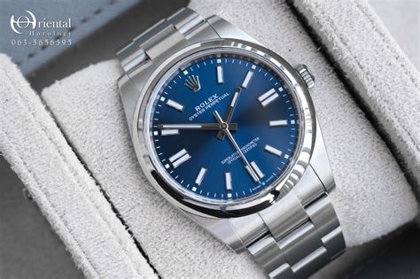 rolex oyster perpetual champagne dial blue markers|rolex oyster perpetual blue price.